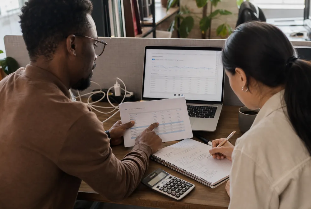 Cloud engineer and operations colleague reviewing infrastructure costs together